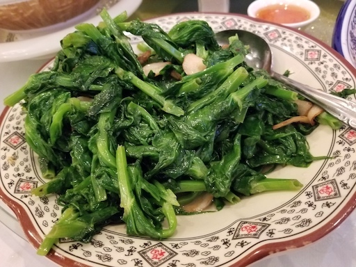 stir-fried pea shoots in garlic